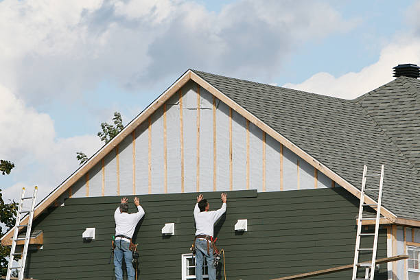 Professional Siding technician working in Medford, MA